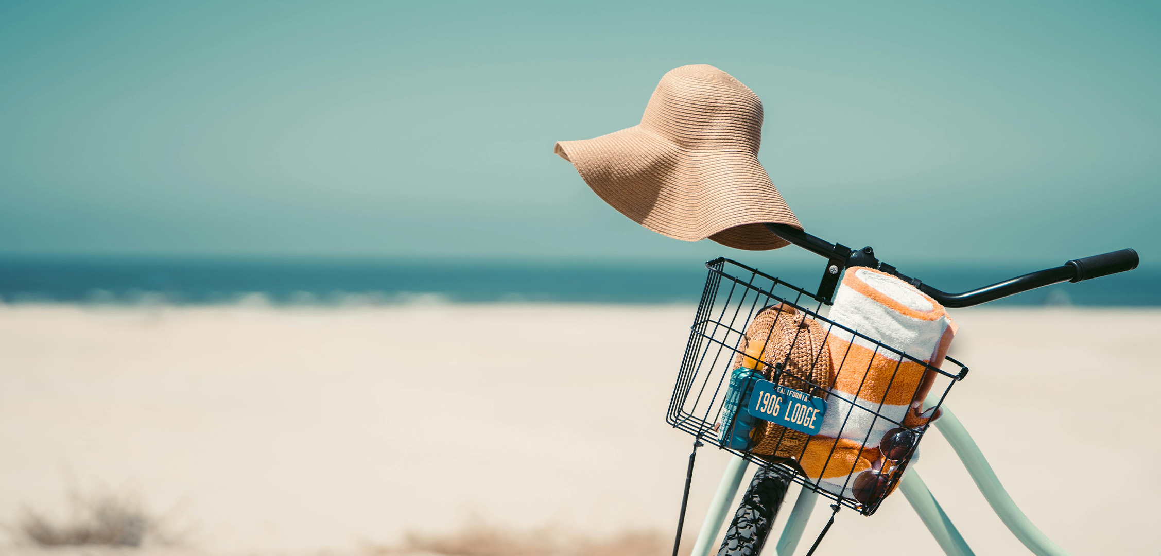 bike with hat on beach. why social media is important for business owners